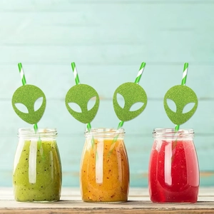 Green glitter alien straw toppers with striped straws for summer party decorations