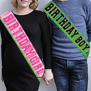 Soccer birthday sashes for boy and girl featuring soccer ball patterns and grass decor