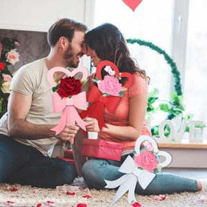 Heart-shaped rose flower wreath with large bow for Valentine's Day home wall decoration