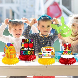 Detail of 4-piece 100 Days of School honeycomb centerpieces on classroom desk