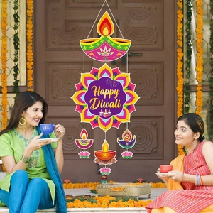 Colorful Happy Diwali hanging door decoration with painted diya and mandala patterns