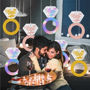 Bride to be party decor featuring honeycombed diamond ring ornaments in various colors