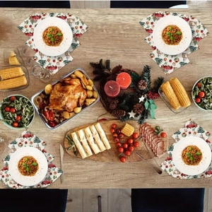 Set of 4 Christmas placemats featuring red vintage truck and tree on wooden table