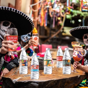 Dia De Los Muertos bottle labels and cup stickers with colorful skull flower designs