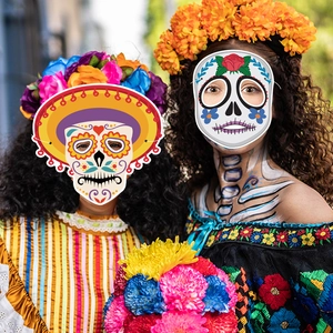 Day of the Dead sugar skull paper masks worn by models for Dia de los Muertos party