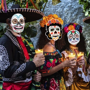 Three Day of the Dead sugar skull masks featuring floral designs and traditional patterns