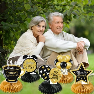 Black and gold retirement table centerpieces including coffee break and no work zone signs