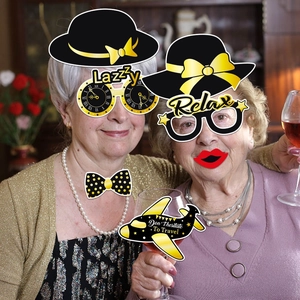 Retirement party photo booth props with black and gold theme decorations and funny accessories