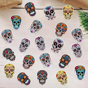 Sugar skull sticker set for Day of the Dead party decor on light wood background