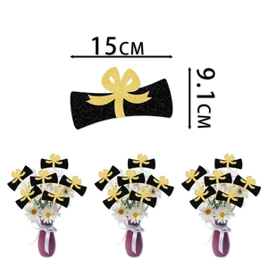 Glittery graduation scroll vase inserts in black and gold for party table decorations