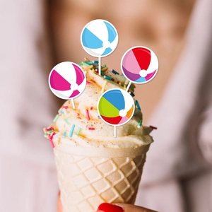 Colorful beach ball cupcake toppers for summer party decorations in four color patterns