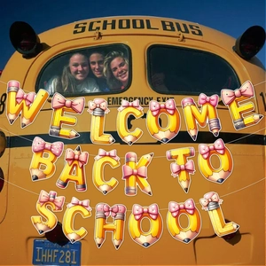 Welcome Back to School banner with yellow pencil letters and bus backdrop decoration
