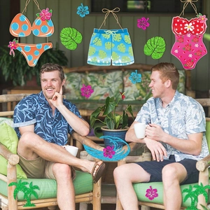 Hawaiian beach party hanging decorations featuring bikini swimwear and tropical palm leaves