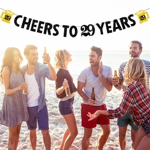 Cheers to 29 Years banner with gold beer mugs for 29th birthday beach party decor