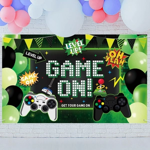 Game On birthday party backdrop featuring pixel art controller and green balloons