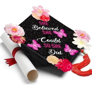 DIY graduation cap with flowers and She Believed She Could So She Did text