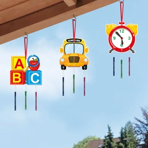 School bus and ABC blocks wind chimes set hanging under eaves for back to school decor