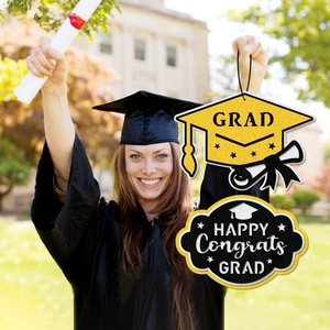 Graduation party door decor set with yellow grad cap and black congrats grad signs