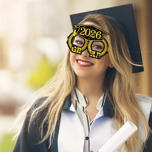 2026 graduation party paper glasses with mortarboard design and gold GRAD lettering