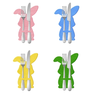 Set of four colorful bunny cutlery holders for Easter table decoration in bright colors