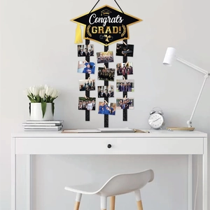 2026 graduation party photo display banner with black and gold Congrats Grad cap sign