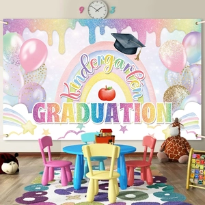 Rainbow kindergarten graduation backdrop with balloons and caps for school party decor