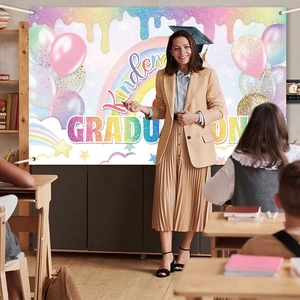 Rainbow kindergarten graduation backdrop with balloons and stars for classroom party decor