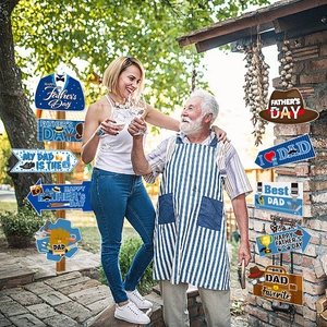 Outdoor yard signs set for Father's Day party decorations featuring ties and arrows