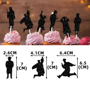 Glittering black graduation cake toppers featuring graduate silhouettes in various poses
