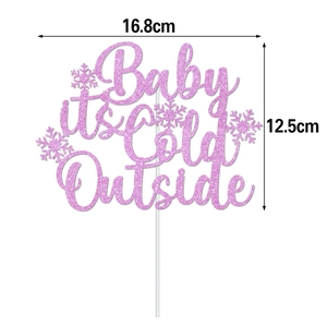 Pink glitter cake topper with Baby it's Cold Outside text and snowflake details, 16.8cm wide