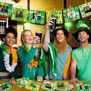 Close-up of St. Patrick's Day DIY photo frames with shamrocks and gold coins decor