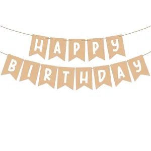 Detail of kraft paper Happy Birthday bunting banner with white lettering for party decor