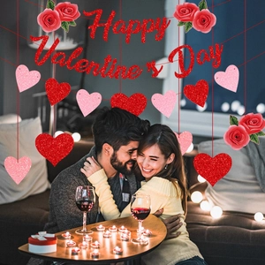 Happy Valentine's Day banner with red glitter letters and heart hanging decorations