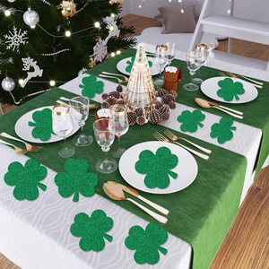Glittery green shamrock decorations on a formal table for St. Patrick's Day celebration
