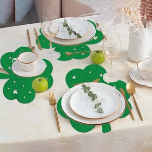 Green St. Patrick's Day shamrock felt placemats with hollow-out design for table decor