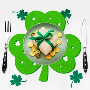 Detailed view of hollow green felt clover placemat for St. Patrick's Day table setting