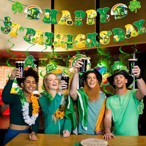 Saint Patrick's Day party decoration set with Lucky banner and green shamrock swirls
