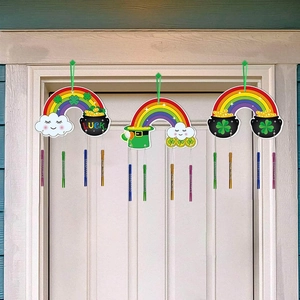 St. Patrick's Day wind chimes with rainbow and lucky gold pot hanging on white door