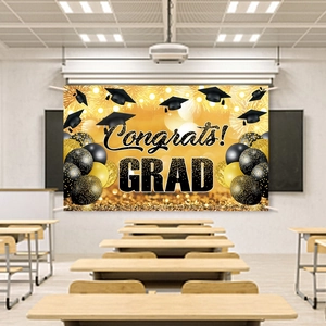 Black and gold graduation backdrop with Congrats GRAD text and balloons for party decoration
