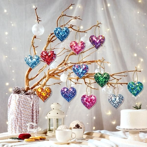 Set of 12 colorful heart-shaped crystal pendants hanging on branches for festive decor