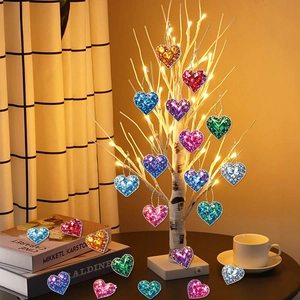 Colorful heart-shaped crystal ornaments set hanging on a decorative holiday tree
