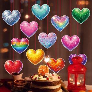 Colorful heart hanging ornaments with various artistic patterns and red string for parties