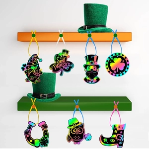 Rainbow scratch art ornaments for Saint Patrick's Day featuring lucky shamrocks and leprechauns