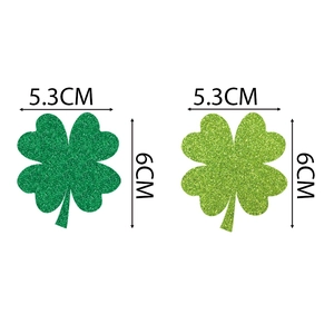 Glitter shamrock straw toppers for St. Patrick's Day party decor in two shades of green