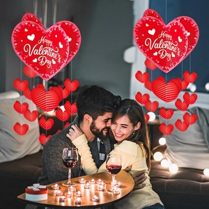 Hanging heart decorations with Happy Valentine's Day text for romantic party decor