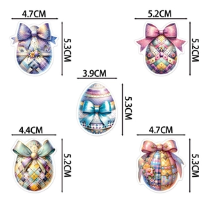 Five assorted Easter egg cake toppers with floral patterns and bow details