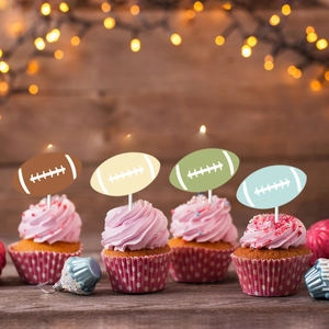 Colorful football cupcake toppers in brown, green, and blue for sports themed birthday party