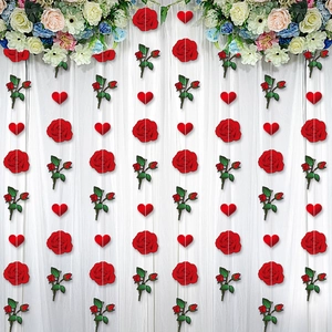 Hanging red rose and heart garland decorations for Valentine's Day party venue styling