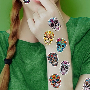 Colorful Day of the Dead sugar skull temporary tattoo stickers on a model's arm
