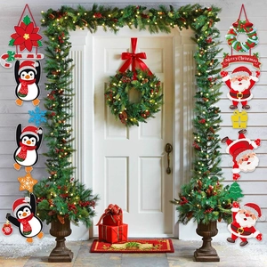 Outdoor Christmas door banners featuring penguins and Santa Claus decorations